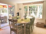 Sunny Dining Room with Doors to Deck